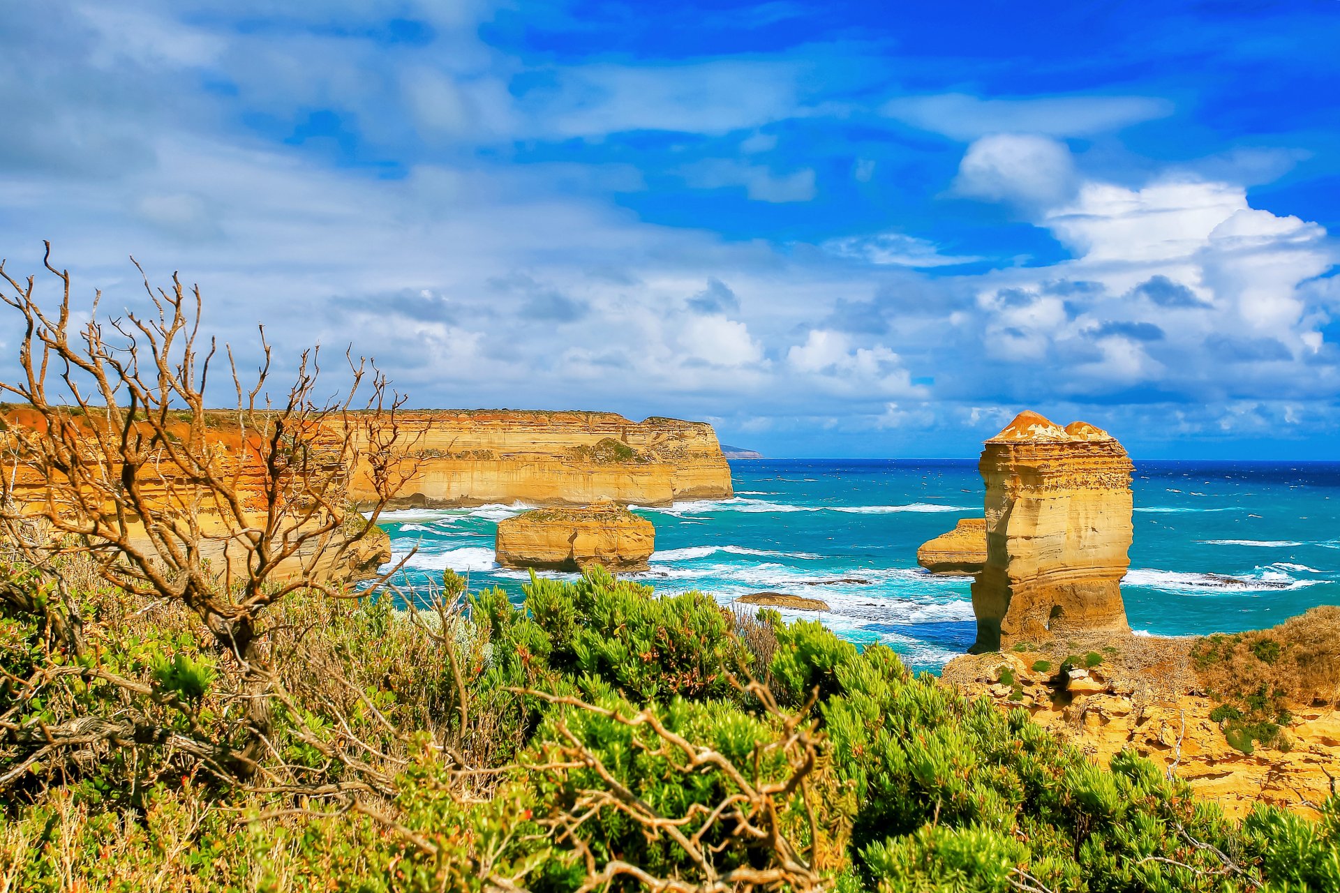 paesaggio oceano mare cielo nuvole scogliera rocce erba orizzonte australia